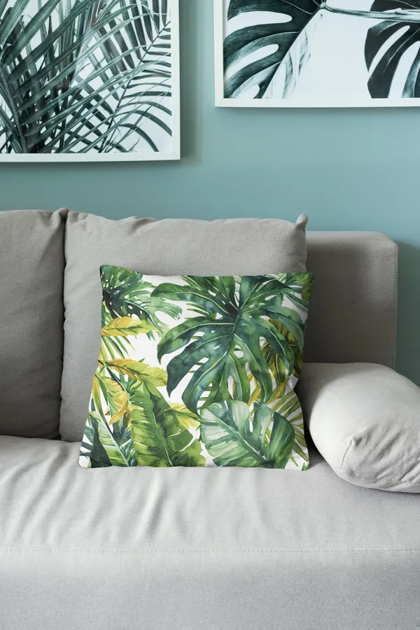 Watercolor Palm Leaves throw pillow on a sofa